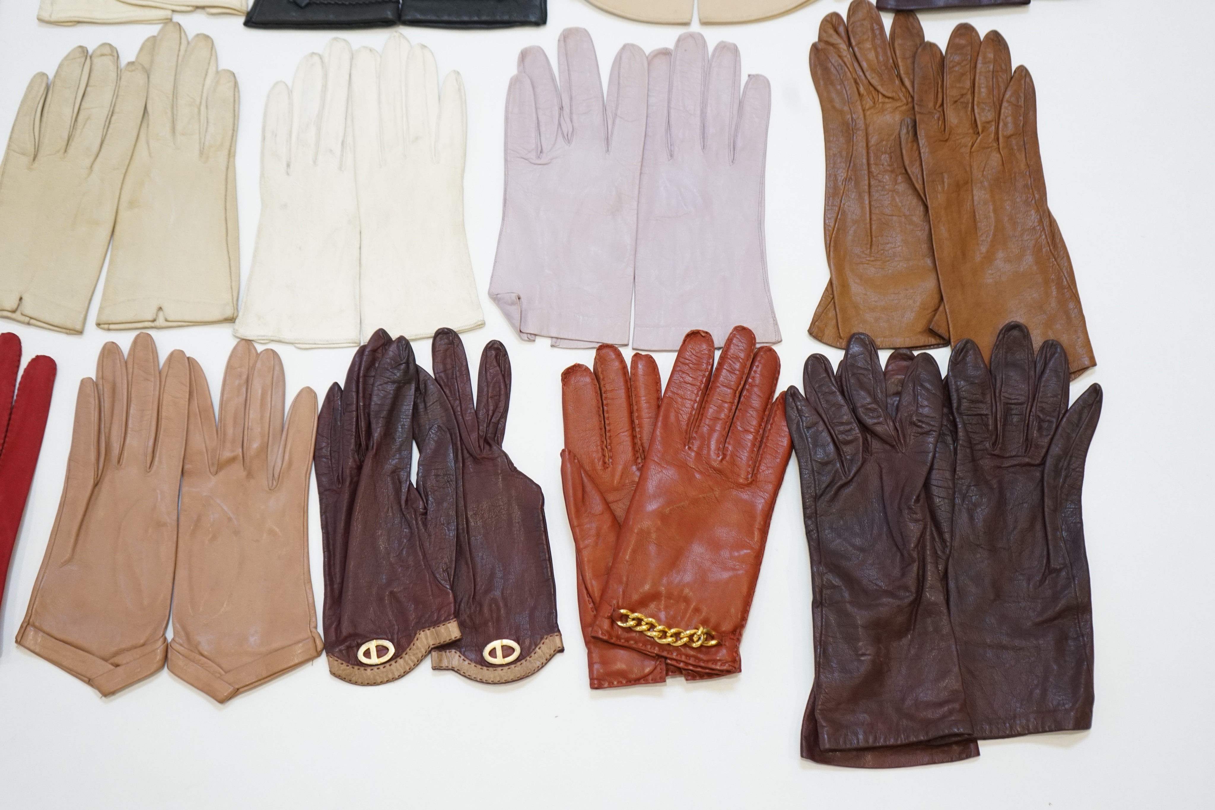 A large collection of assorted ladies gloves, including Christian Dior, many unworn, size 7-7.5